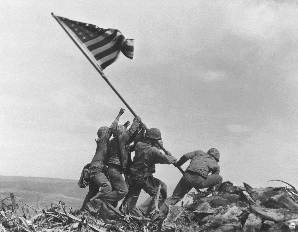 The iconic photo of Iwo Jima flag raising recreated by the emoployees of Prague’s maintenance services — Pražské služby and Wikimedia Commons Just like Abbey Road: Prague workers show some real sense of humour